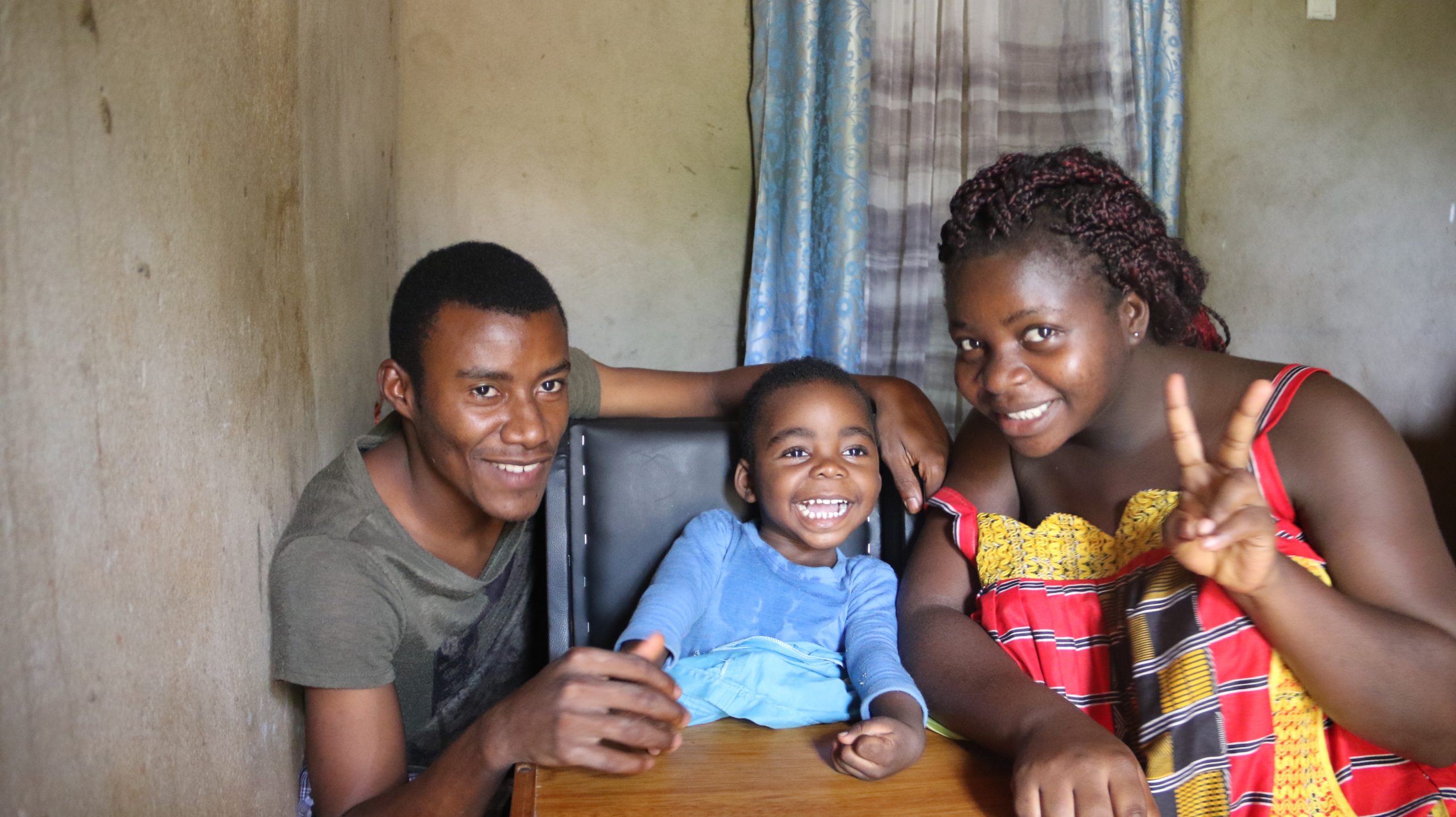 Bright (2 years, brain damage) with his parents Roben and Christabel