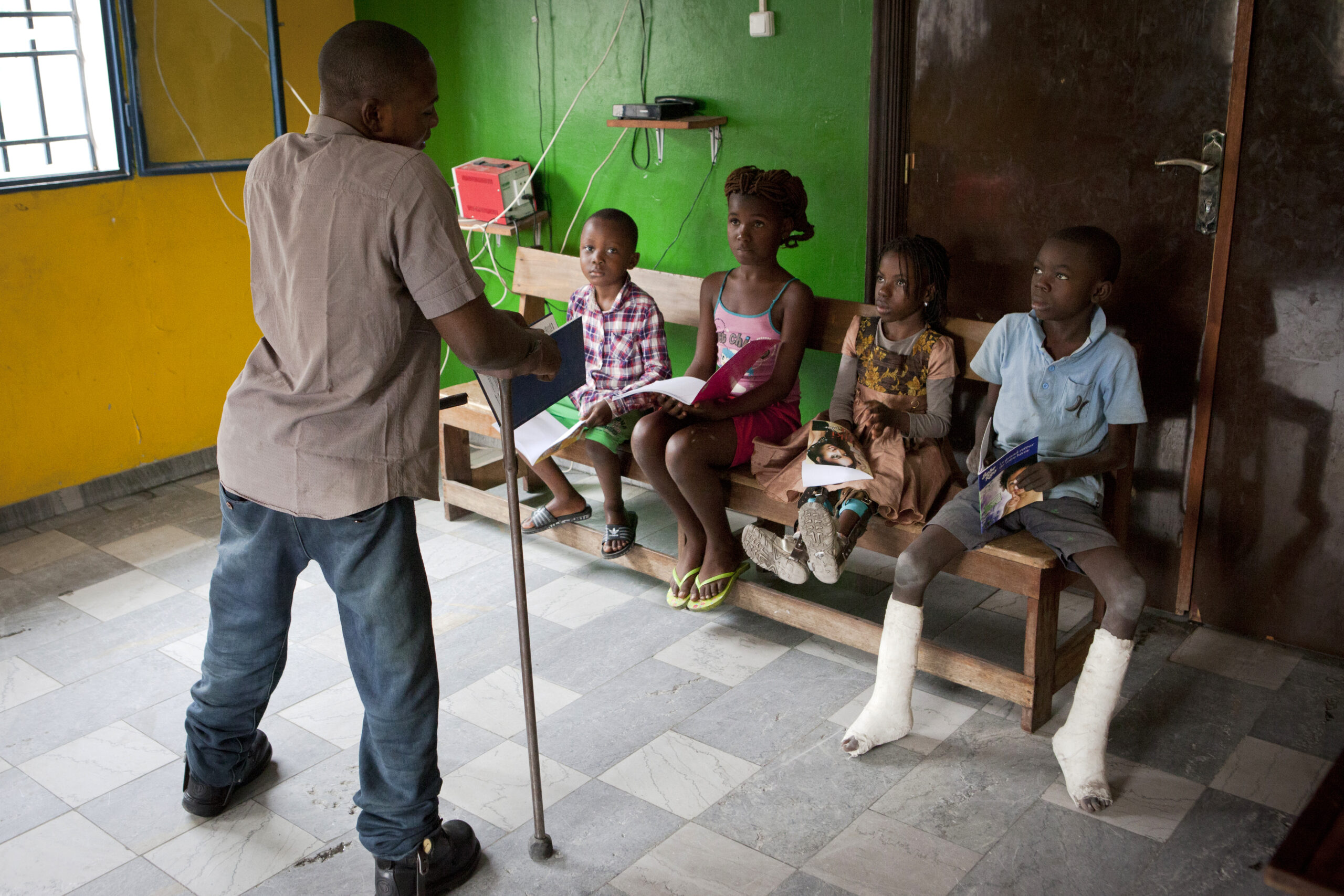 Janela Landu is at the ACDF center getting lessons from Lucien Mpay.