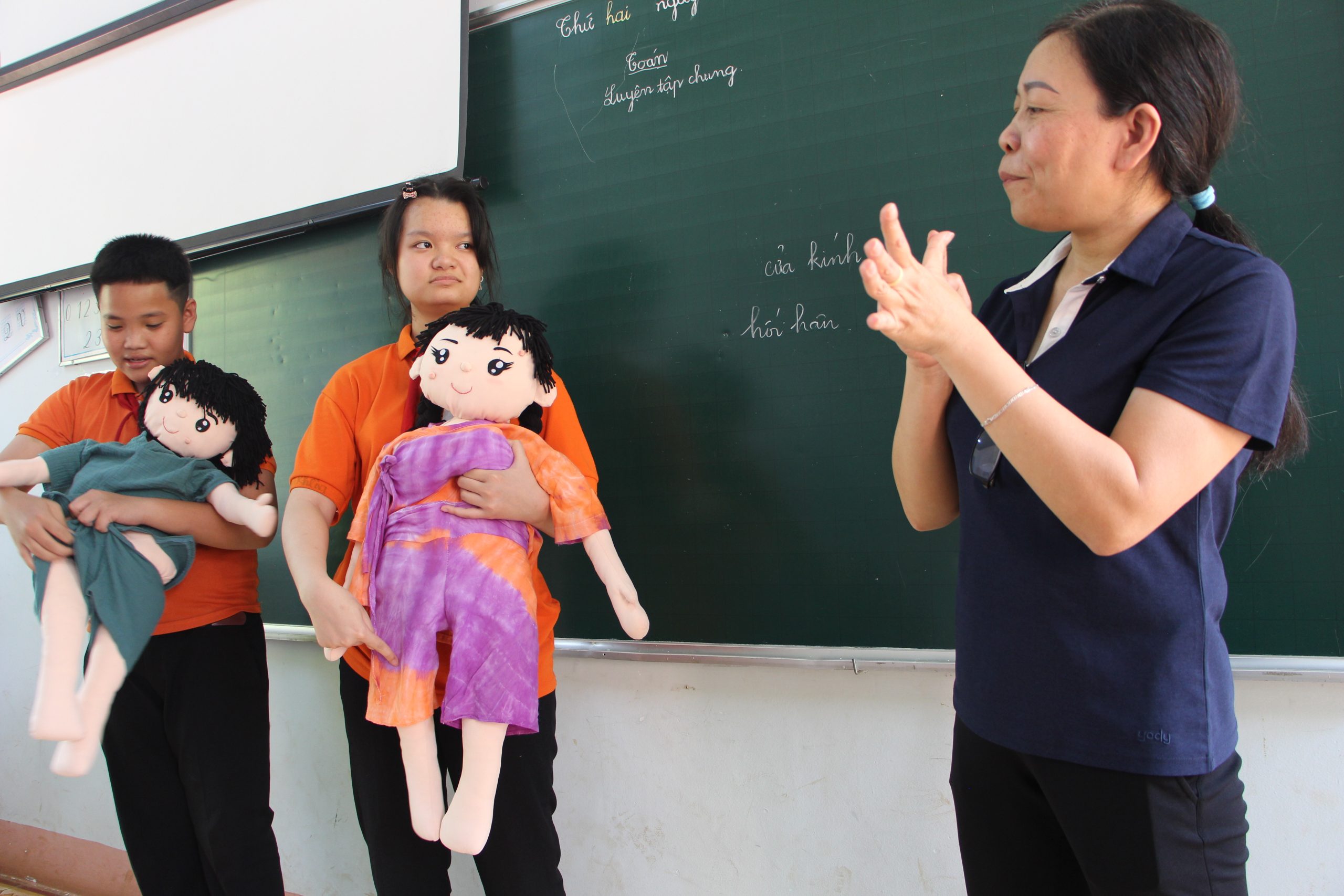 Two youth champions with a hearing impairment give a class to other youth with disabilities.