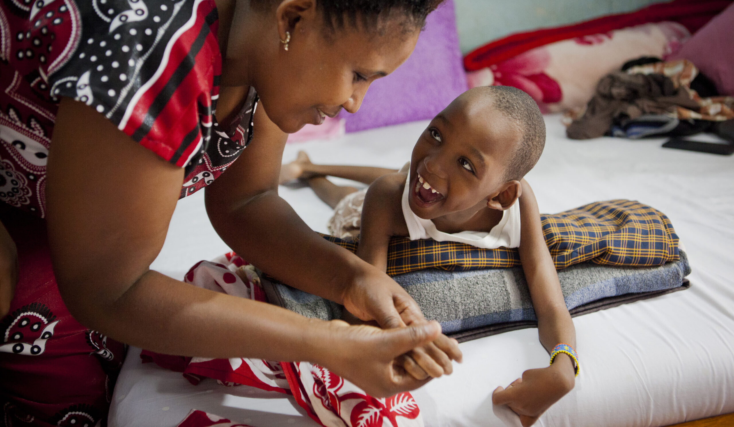Healthworker Ritha is visiting Goodluck Frederik at his home.