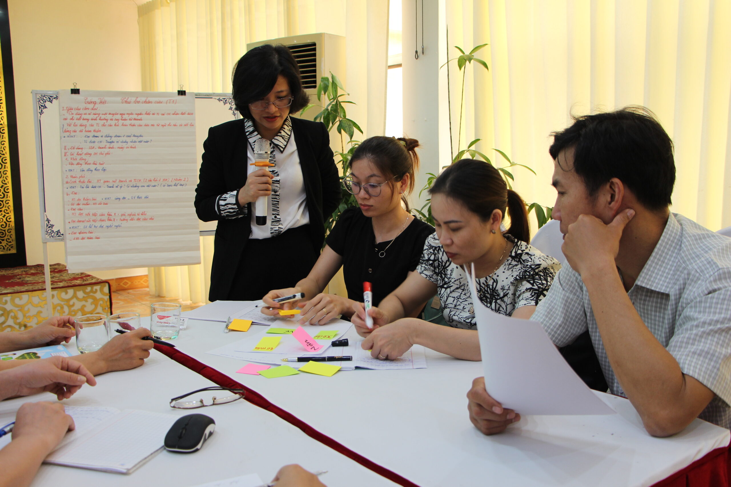 Ms Tam guiding a teachers' training