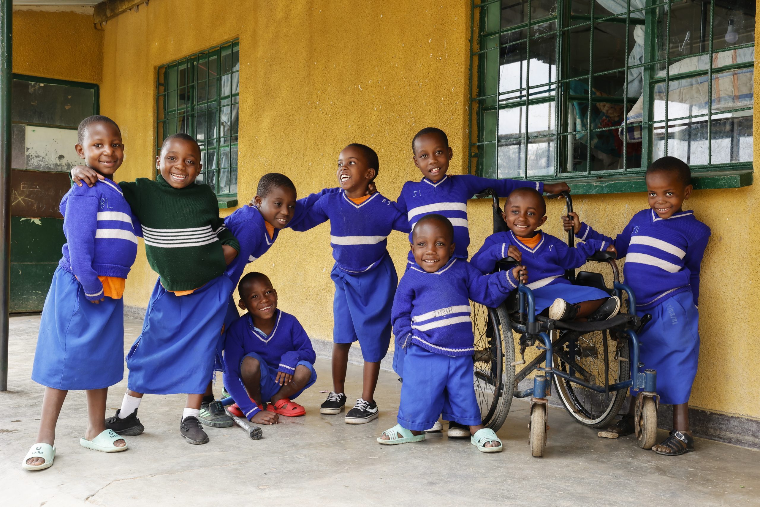 A group of children smiling at the camera