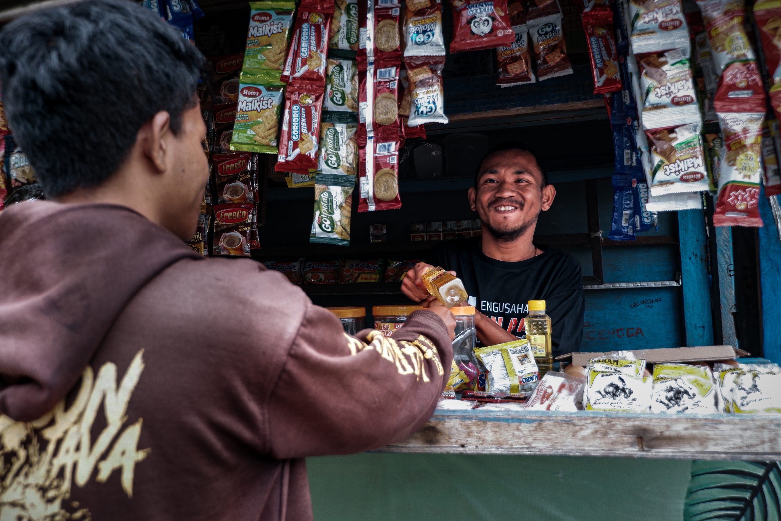 Candra helping a customer