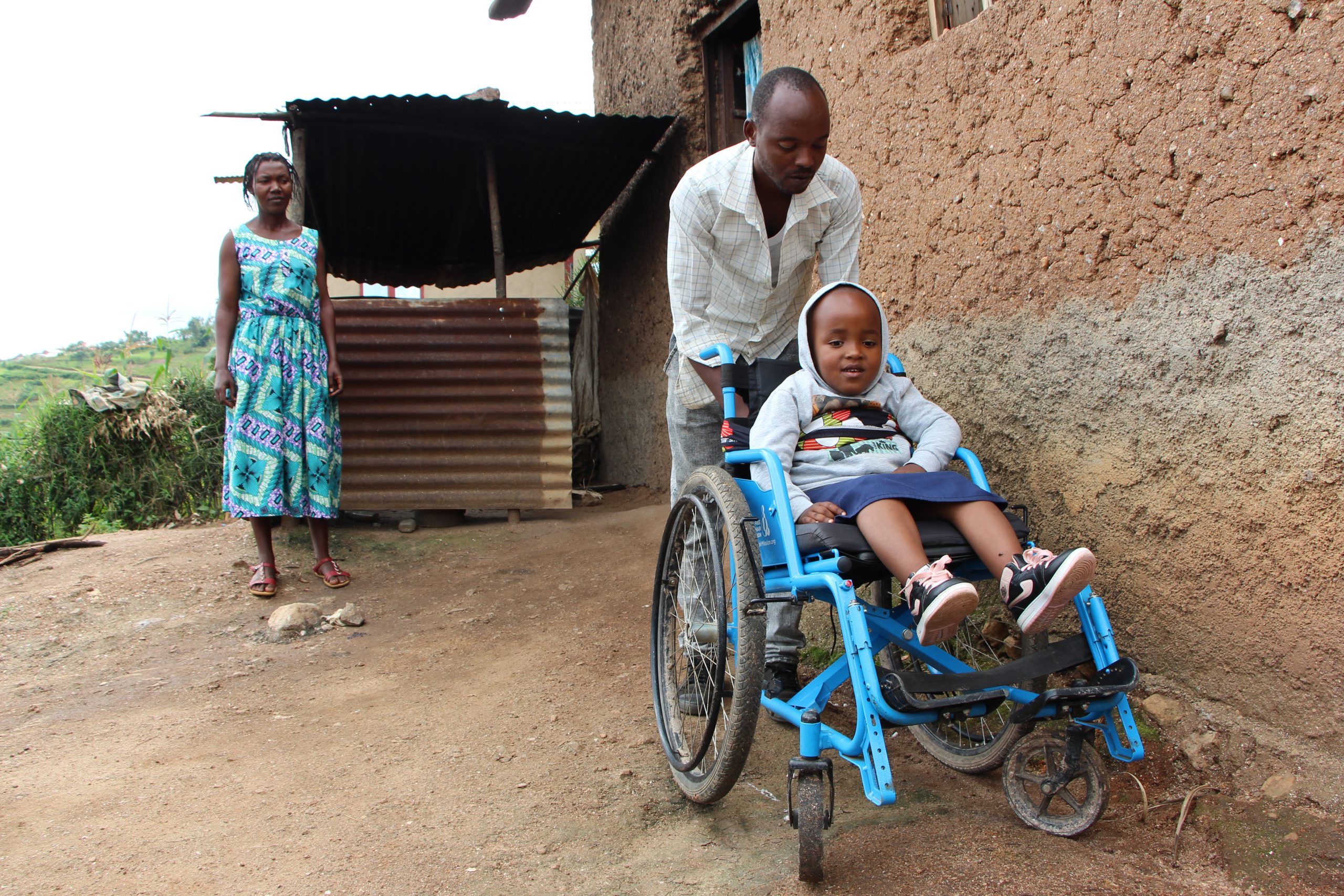 Naomi from Rwanda with her parents