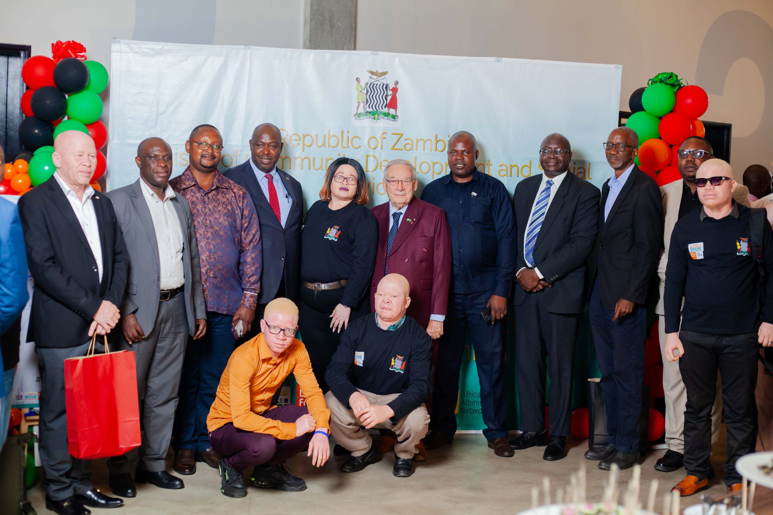 At the official endorsement and handover of the National Action Plan for the protection of people with albinism in Zambia, those present pose for a group photo.